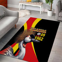 Area rug featuring crowned crane and Uganda 09 1962 text on black with red/yellow stripes
