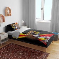 Black bedding set on bed with crowned crane and Uganda “09 October 1962” graphic; 2 pillow covers