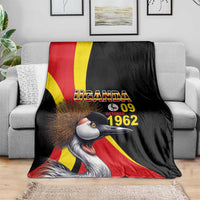 Black blanket featuring crowned crane face and Uganda flag stripes with "UGANDA 09 1962"