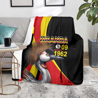 Black blanket with crowned crane graphic, red/yellow flag stripes, and "UGANDA 09" date