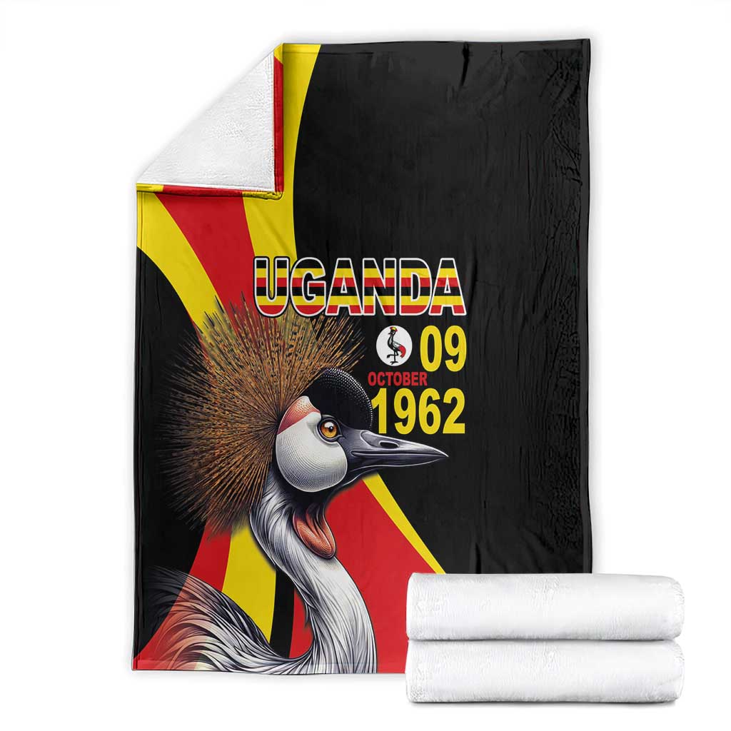 Black folded blanket with crowned crane, Uganda flag stripes, and "UGANDA 09 1962" print