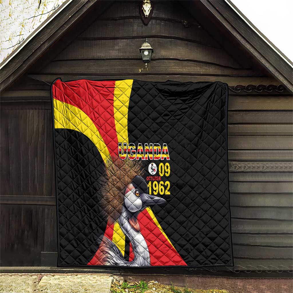 Black quilt hanging on wooden wall with Uganda crowned crane and text "UGANDA 09 1962"