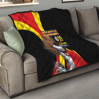 Black quilt draped over sofa with Uganda crowned crane and text "UGANDA 09 1962"