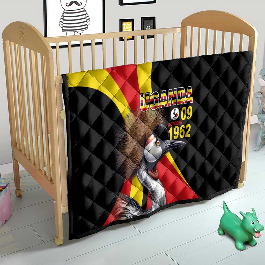 Black quilt on crib with Uganda crowned crane graphic and text "UGANDA 09 1962"