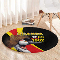 Black round carpet with Uganda 09 1962, crowned crane head and red-yellow flag bands