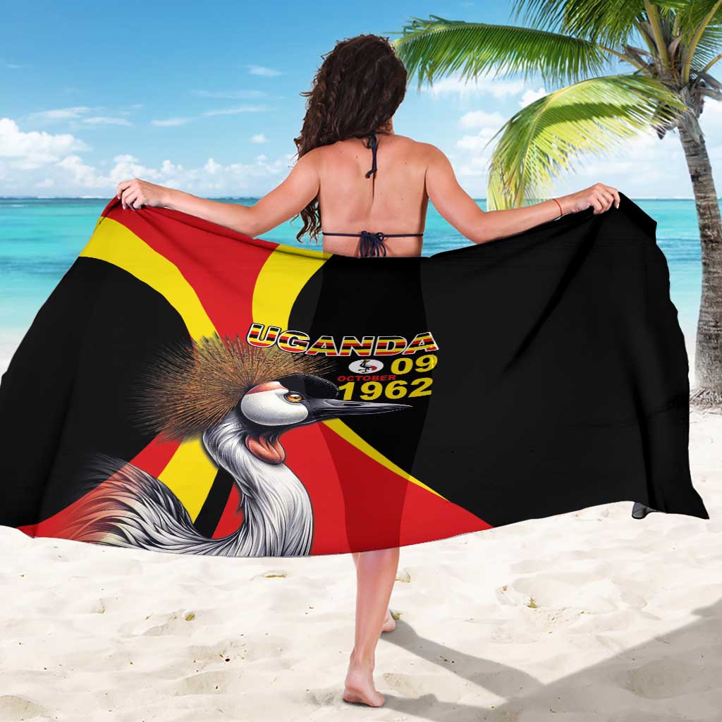 Black sarong with Uganda flag design and crowned crane graphic, worn back view