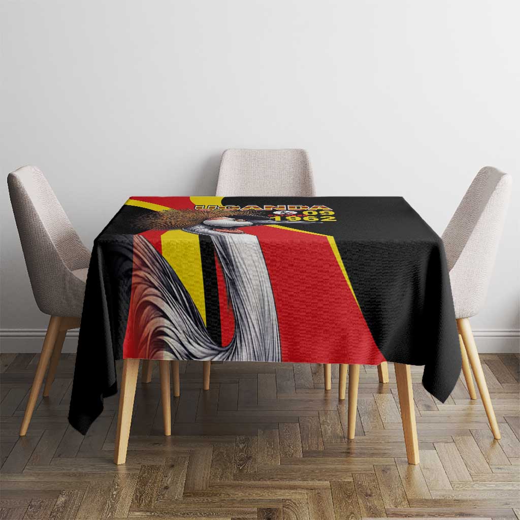 Black tablecloth on dining table featuring crowned crane and red-yellow flag stripe design