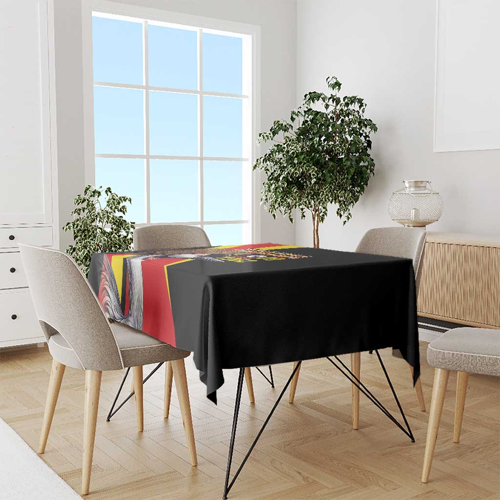 Black tablecloth with Uganda crowned crane and flag stripe graphic on dining chairs