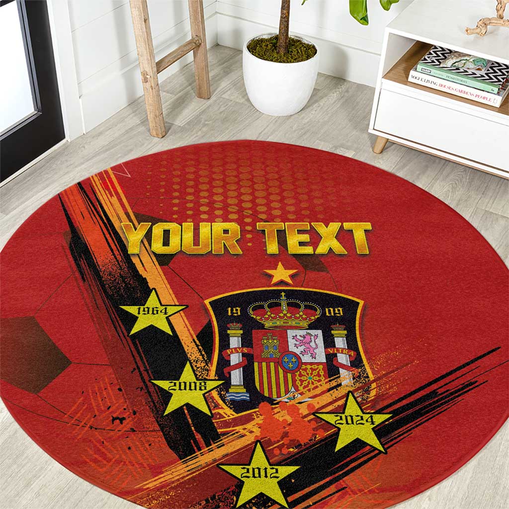 Red round Spain football rug close-up: crest, stars, and 'YOUR TEXT'.