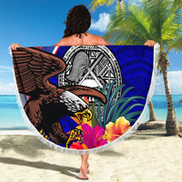 Round beach blanket with eagle and seal graphic on blue-red Polynesian pattern, white fringe.
