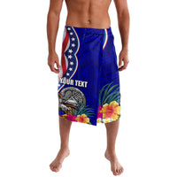 Blue Polynesian board shorts with US flag stars, hibiscus flowers, and front emblem