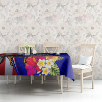 Blue tablecloth featuring hibiscus flowers and leafy tropical design on a living-room table