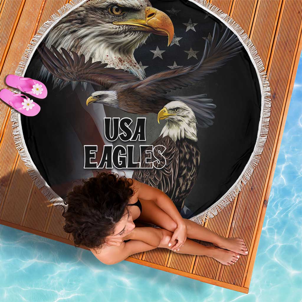 Round black beach blanket with white fringe and USA Eagles text, eagle faces design.