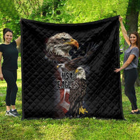 Black quilt blanket spread outdoors, featuring eagles graphic and USA Eagles logo