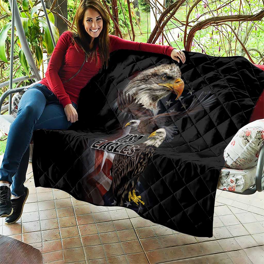 Black quilt blanket on a couch with eagle artwork and USA Eagles logo