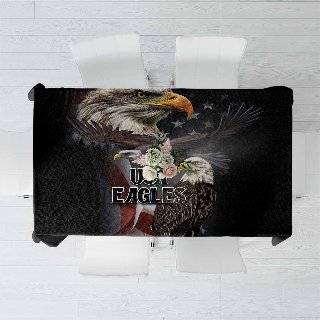 Black tablecloth close-up with eagle portrait and eagle-themed emblem graphic.
