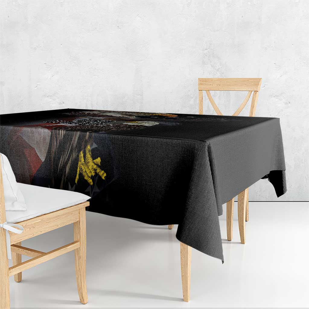 Black tablecloth with vintage American eagle and flag graphic, draped over table edge.