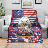 American Eagles eagle flag camouflage blanket draped on couch, red and blue camouflage