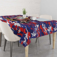 Tablecloth with red white blue camouflage flag print, set on dining table with chairs