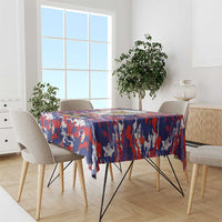 Patriotic tablecloth in red, white, and blue camo flag design on dining table