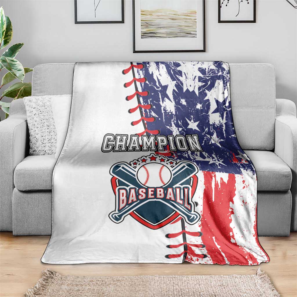 White baseball blanket on gray sofa with blue stars, red stripe panel, bat emblem