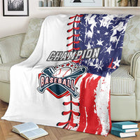 White baseball blanket folded on beige couch, 'Champion Baseball' logo and baseball bat
