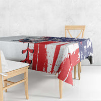 Patriotic baseball tablecloth draped over table, red and white stripes with blue stars