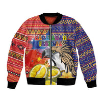 Red and blue bomber jacket with eagle head, durian, and festive tribal graphics