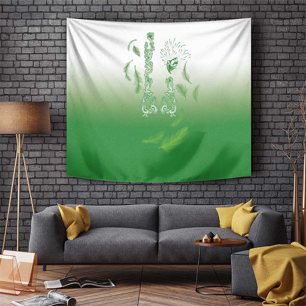 Green gradient tapestry with ornate crest and feather motif, hung on a wall.