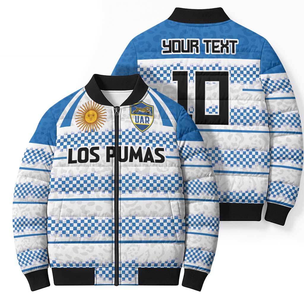 Blue and white checkered puffer bomber with front zip, 'LOS PUMAS' logo, and UAR crest.