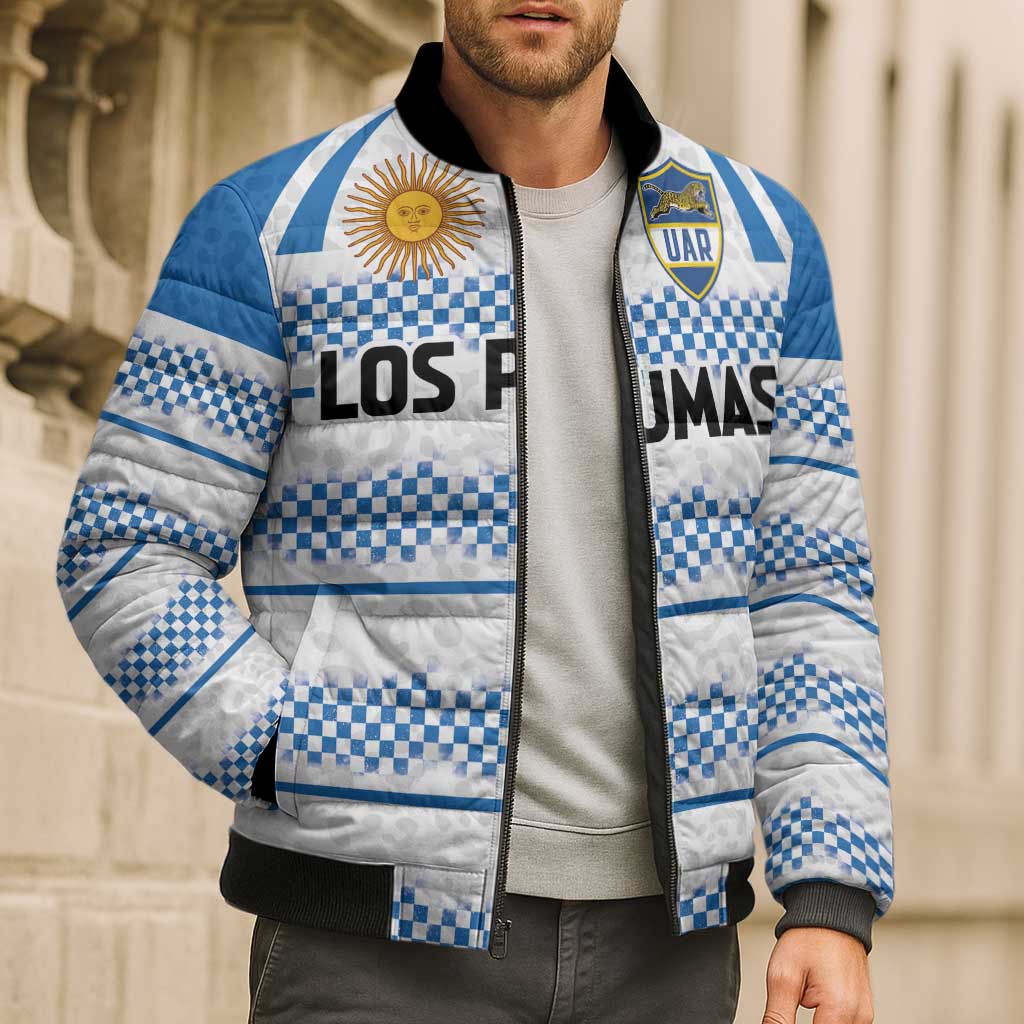 Model wearing blue and white checkered puffer bomber with black ribbed cuffs and zip front.