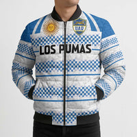 Blue and white checkered puffer bomber jacket with zip front, black trim, and UAR crest patch.