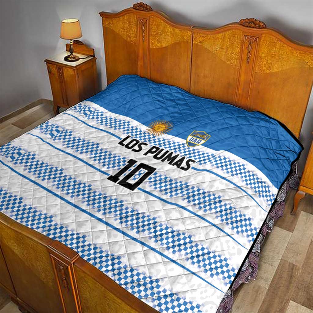 Blue and white quilt with quilted look, checker stripe design, LOS PUMAS and number 10