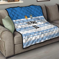 Blue and white quilt with quilted texture, checker stripes, LOS PUMAS text and crest