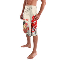 Beige lavalava shorts with red cherry blossoms and samurai portrait on side
