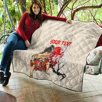 Beige quilt on bench with diamond stitching, red “YOUR TEXT” and samurai cherry blossom art.