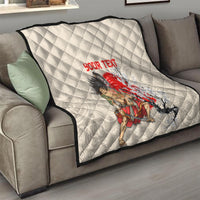 Beige quilt on gray sofa, diamond pattern with red “YOUR TEXT” and samurai cherry blossoms.