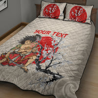 Beige quilt bed set showing large samurai and cherry blossom print with red text; 2 pillows