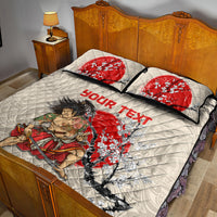 Beige quilt bed set with red lettering and samurai cherry blossom scene; quilt and 2 pillows