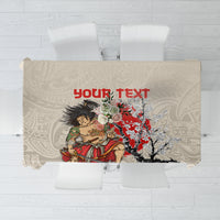 Beige tablecloth with samurai figure and red floral and tree graphic print