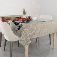 Beige tablecloth with samurai and floral scene; drapes over dining table