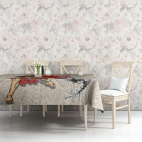 Beige tablecloth with red banner, black warrior, and gray swirl motif on table