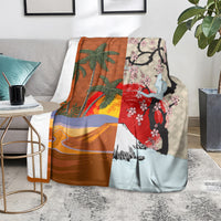 Brown blanket over sofa with palm trees, red flowers, and blue mountain scene