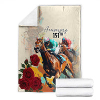 White horse racing anniversary blanket with “Anniversary 151st,” three jockeys, roses, folded