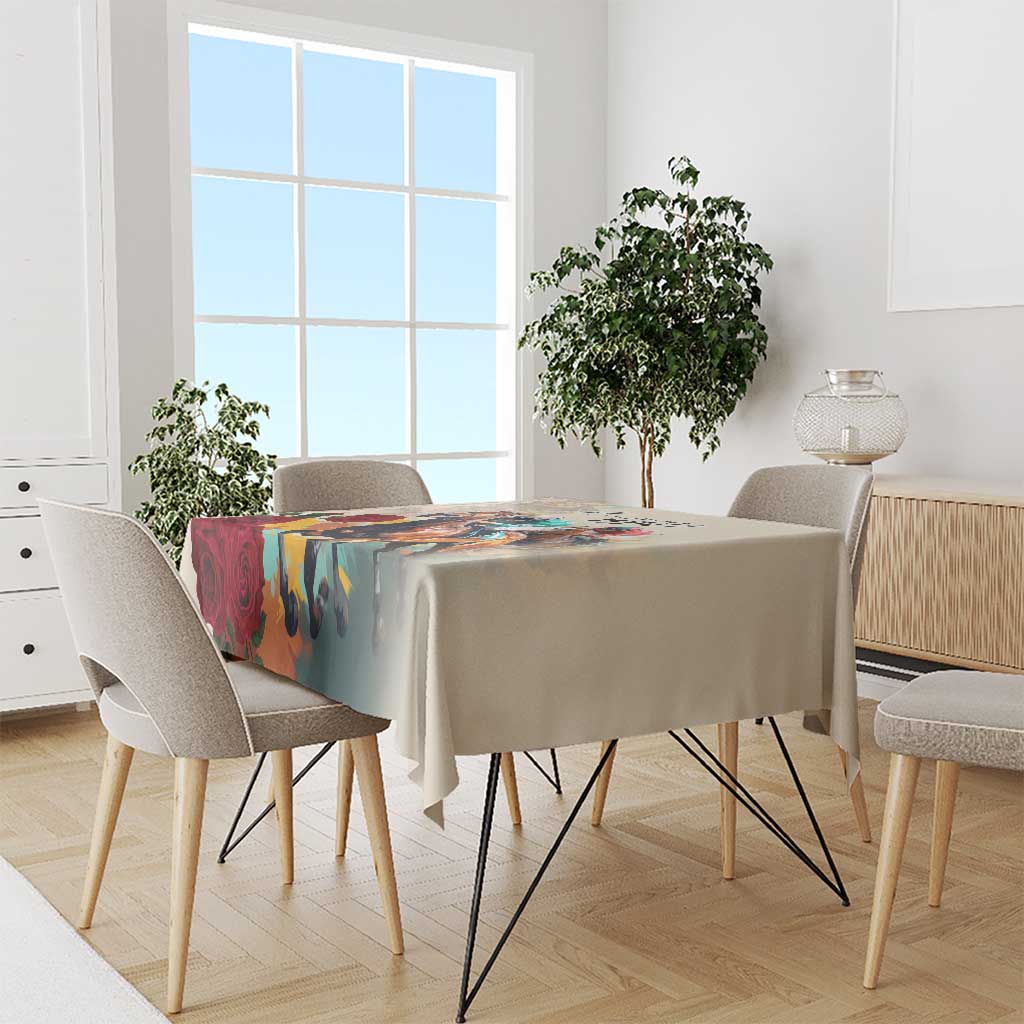 Colorful horse and rose print tablecloth covering a dining table