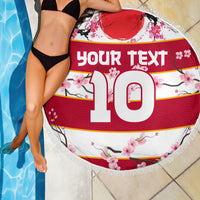 Round beach blanket with fringed edge, red/white sakura pattern and big 10 text