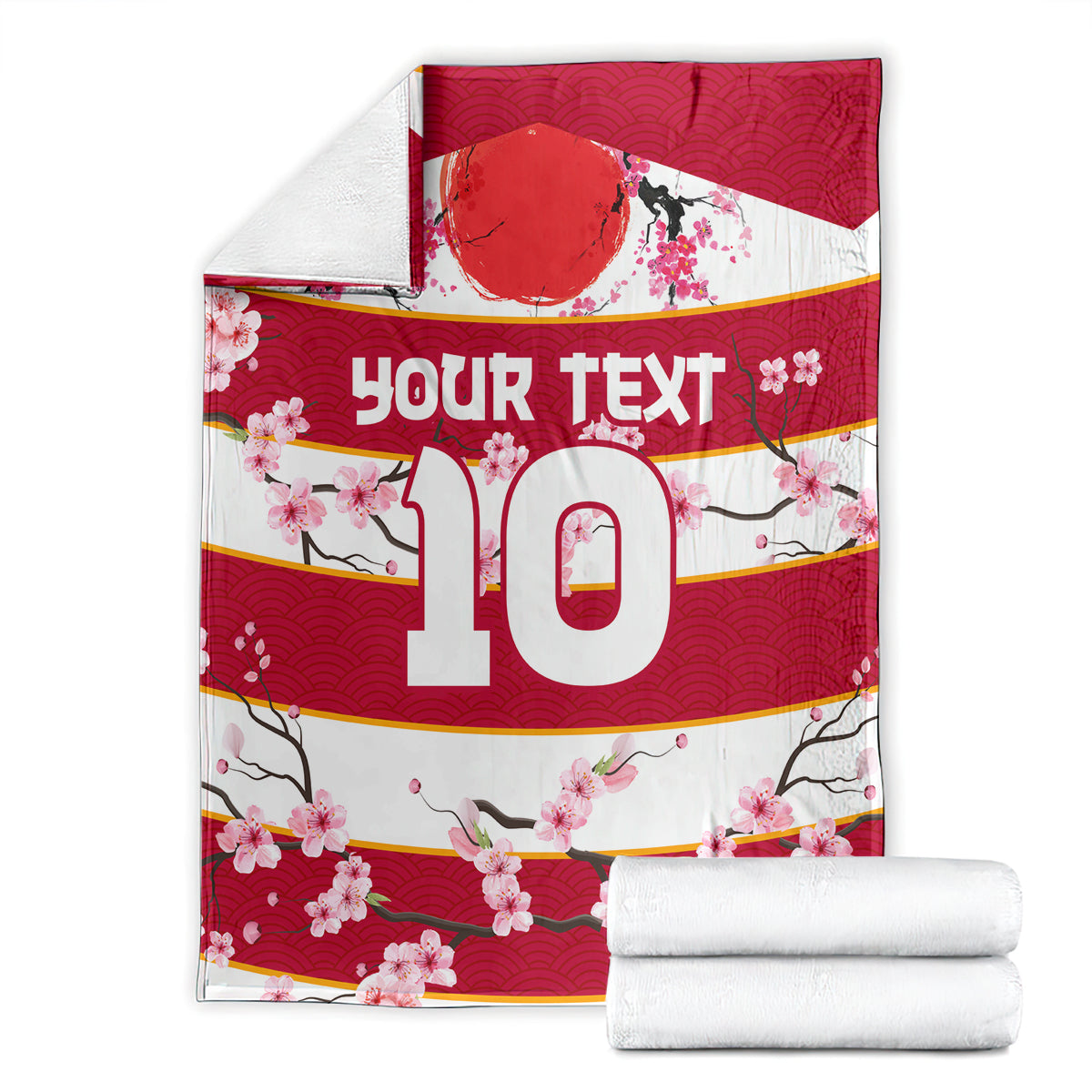 Red rugby blanket folded with white edges, 'Your text 10' and pink cherry blossom print