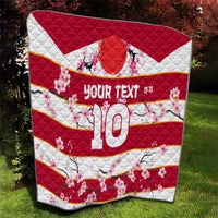 Red, white, and yellow-striped rugby quilt with cherry blossoms, 'YOUR TEXT' and 10