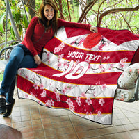 Red rugby quilt with cherry blossoms, 'YOUR TEXT' and number 10, quilted stitching