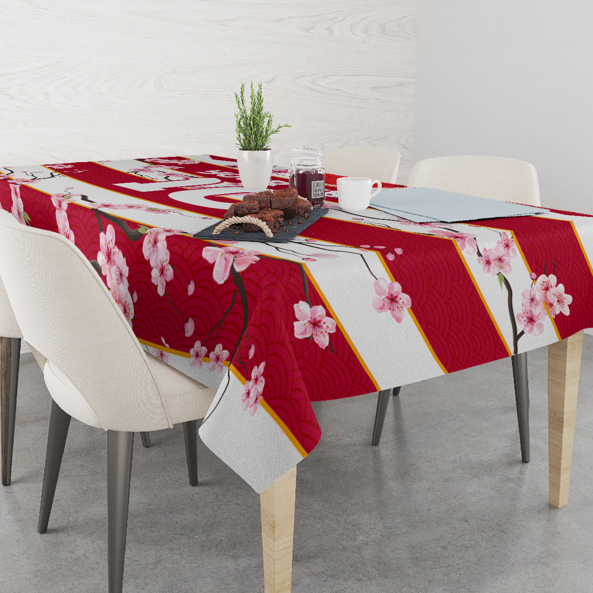 Red cherry blossom tablecloth with gold diagonal bands and pink floral print